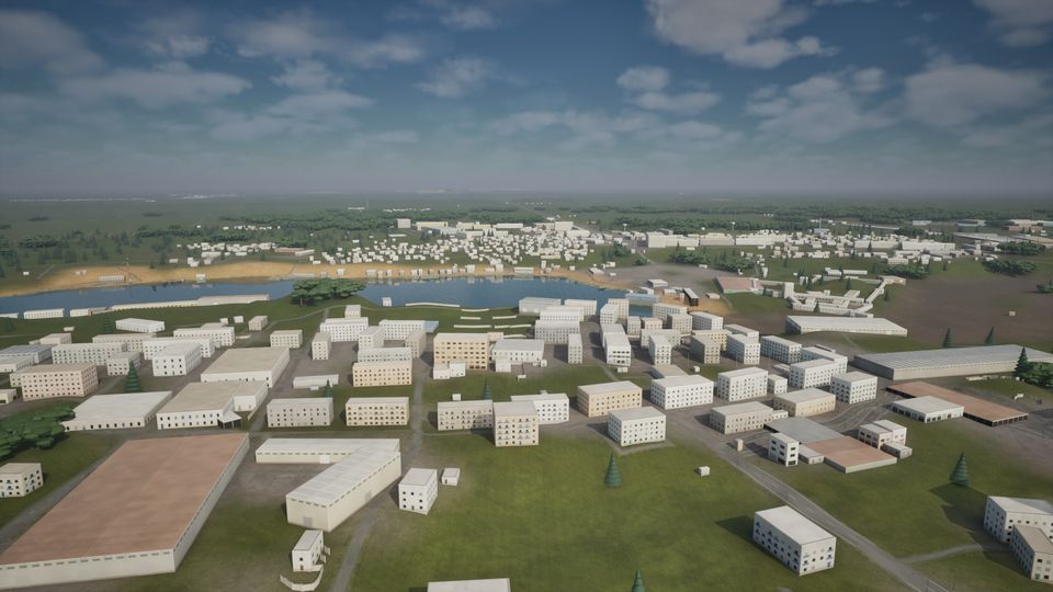 Narva from the air: apartment blocks, a river and flat green country